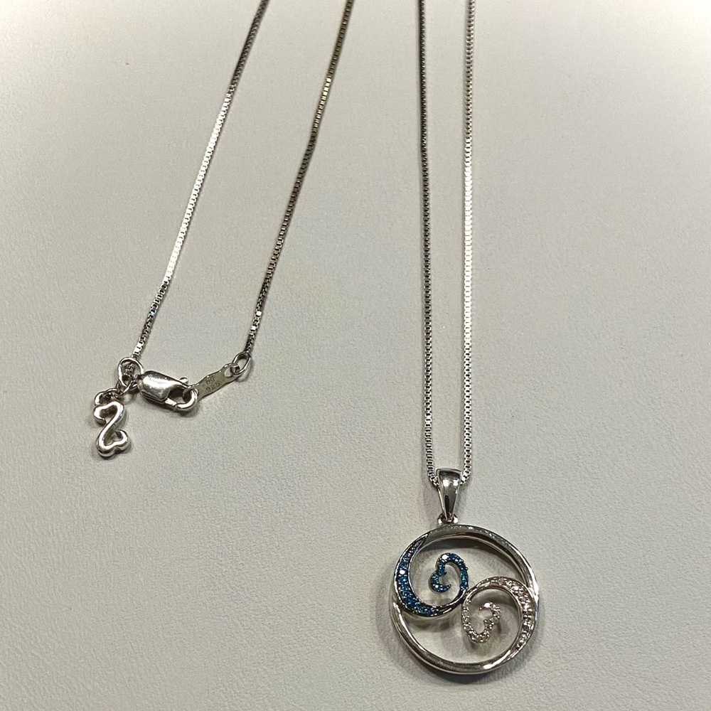 Jane Seymour “Open Hearts” pendant with blue sapphires